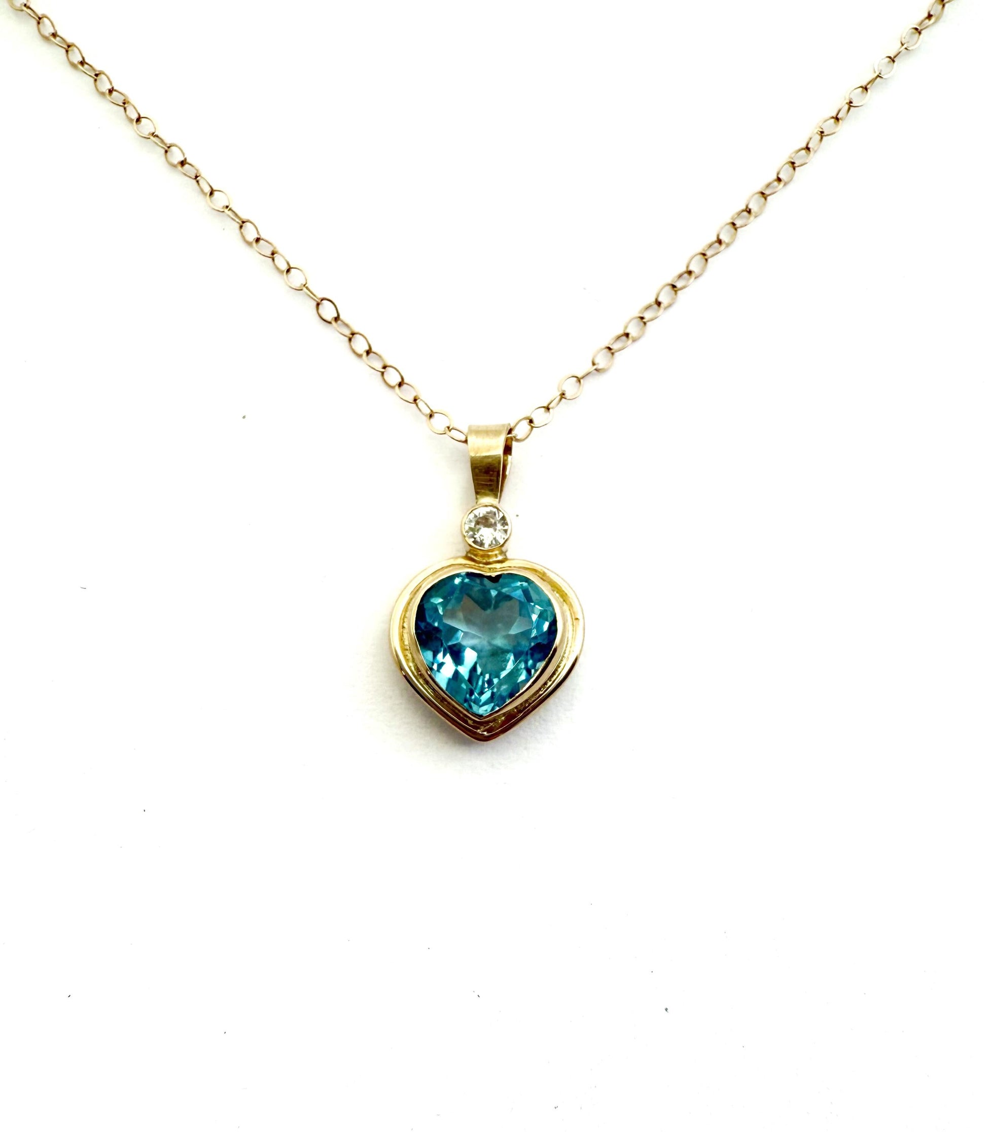 Blue Topaz Heart Pendant with Diamond Accent in 14k Gold