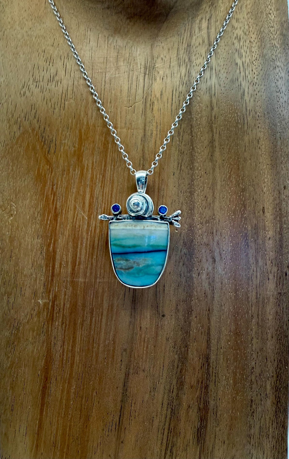 Opalized wood with kyanite in sterling silver pendant