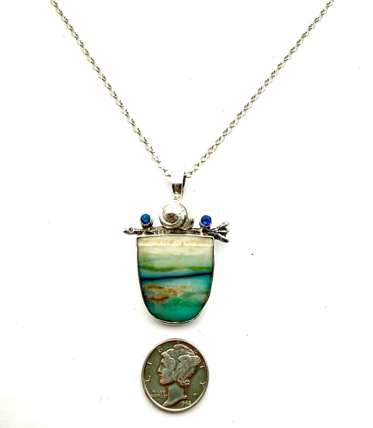 Opalized wood with kyanite in sterling silver pendant