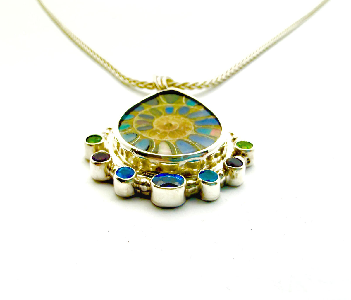 Ammonite Fossil Inlaid with Ethiopian Opals and Accented with gemstones