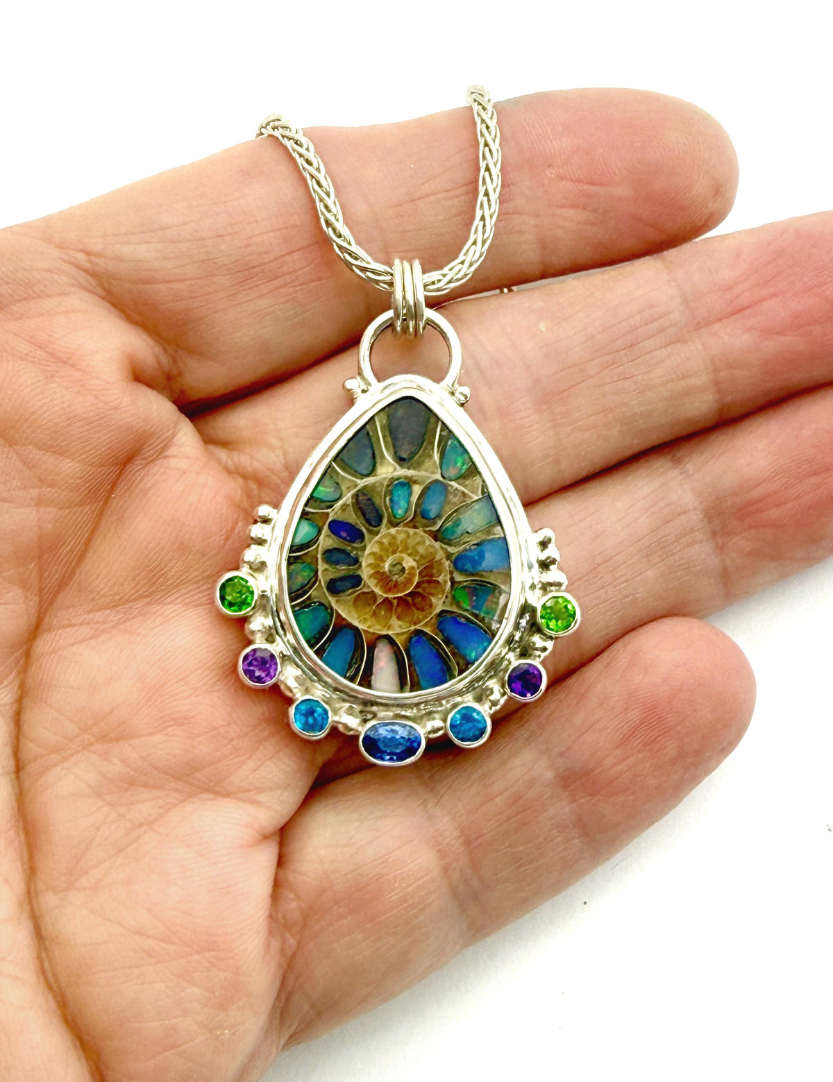 Ammonite Fossil Inlaid with Ethiopian Opals and Accented with gemstones